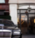 luxury car outside of a luxury hotel